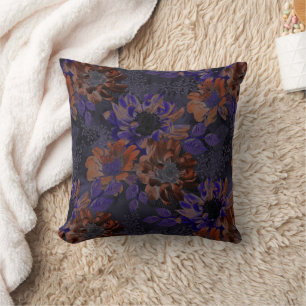 Terracotta, purple flowers on a velvety gray cushion