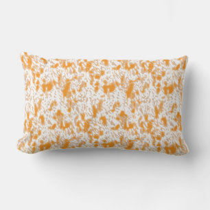 Textile pattern featuring a vibrant orange and gol lumbar cushion