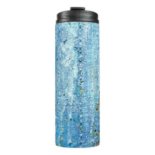 Textured concrete wall, rust stains. thermal tumbler