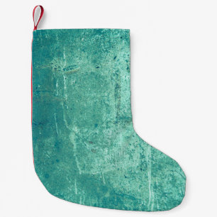 Textured vintage stripped blue wall. Background of Small Christmas Stocking