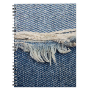 Textures ripped jeans background. notebook