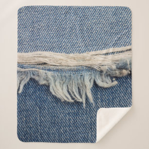 Textures ripped jeans background. sherpa blanket
