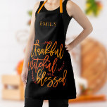 Thankful Grateful Blessed Name Orange Yellow Black Apron<br><div class="desc">Thankful Grateful Blessed Name Orange Yellow Black> Awesome inspirational words to wear for thanksgiving and throughout the year, I n a large elegant script, the words of gratitude Thankful Grateful Blessed in the vibrant colours of fall on a black background which can be changed to another colour if you so...</div>