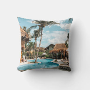 Thatch huts and houses by the pool during day cushion