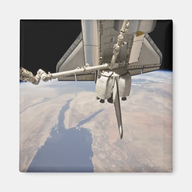 The aft section of the docked space shuttle magnet (Front)