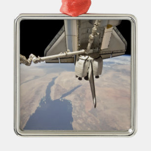 The aft section of the docked space shuttle metal tree decoration