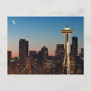 The American flag flies between the rising moon Postcard