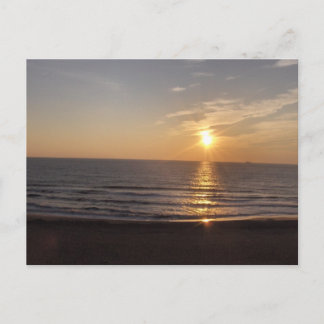 The beach at sunset postcard