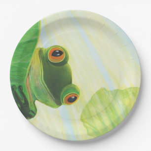 The big-eyed green frog behind lily pad paper plate