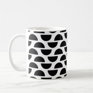 The black halves of the circle create a simple pat coffee mug