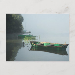 The boats on calm lake water - postcard