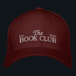 The book club Hat<br><div class="desc">Complete your bookish look with "The Book Club" Hat! This stylish and versatile hat is the perfect accessory for any book lover, adding a touch of literary charm to your everyday outfits. Designed with "The Book Club" embroidered on the front, our hat proudly showcases your love for reading and celebrates...</div>