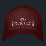 The book club Hat<br><div class="desc">Complete your bookish look with "The Book Club" Hat! This stylish and versatile hat is the perfect accessory for any book lover, adding a touch of literary charm to your everyday outfits. Designed with "The Book Club" embroidered on the front, our hat proudly showcases your love for reading and celebrates...</div>