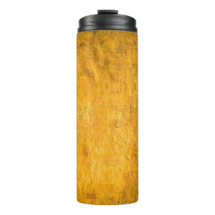 The brass concrete surface glows from the walls of thermal tumbler