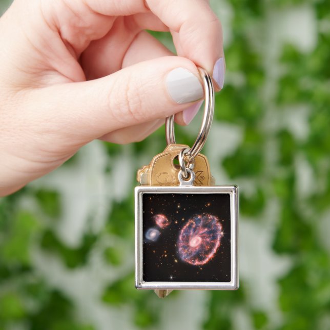 The Cartwheel Galaxy And Its Companion Galaxies. Key Ring (Hand)