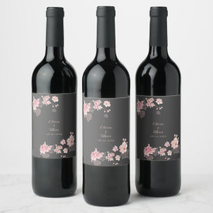 The chic pink sakura flowers on a dark grey wine label
