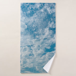 The clear sky during the day when the light passed bath towel