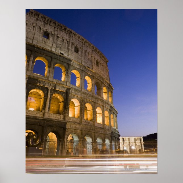 the Colosseum ampitheatre illuminated at night Poster (Front)