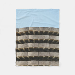 The concrete exterior of a multi-story parking lot fleece blanket
