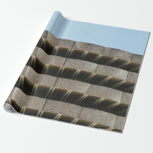 The concrete exterior of a multi-story parking lot wrapping paper