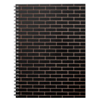 The dark black brick wall has a rough surface as a