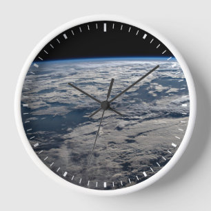 The Earth's Limb Above A Cloudy Western Australia. Clock