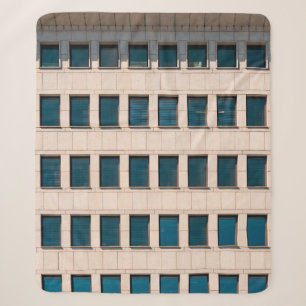The facade of the modern building with rectangular sherpa blanket