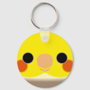 The face of a cinnamon pied male cockatiel key ring