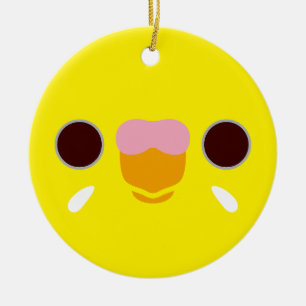 The face of a lutino budgie ceramic ornament