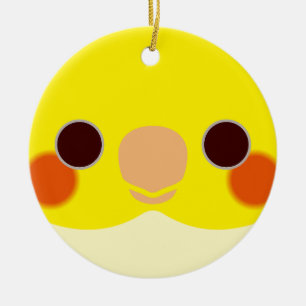 The face of a lutino cockatiel ceramic ornament