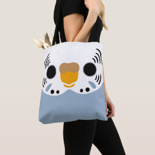 The face of a normal grey female budgie tote bag