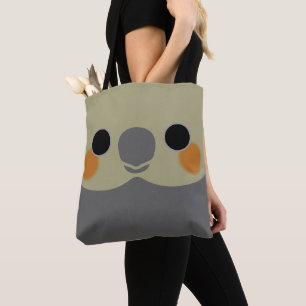 The face of a normal grey female cockatiel tote bag