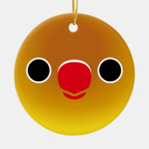 The face of a pastel green masked lovebird ceramic ornament