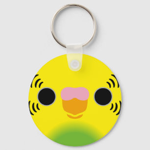 The face of a recessive pied budgie key ring