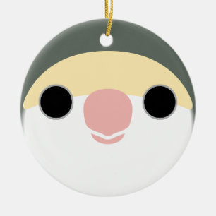 The face of a white-faced mauve peach-faced lovebi ceramic ornament