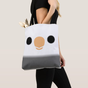 The face of a white-faced pied male cockatiel tote bag