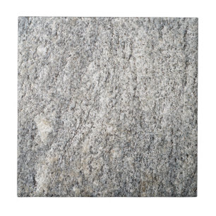 The flat surface of a grey granite stone ceramic tile
