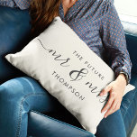 The Future Mr and Mrs Elegant Script Calligraphy Lumbar Cushion<br><div class="desc">Celebrate your love with this chic and romantic throw pillow featuring your future Mr & Mrs family name in charcoal vintage script calligraphy lettering. Choose your own background colour under customise further. This would make the perfect gift for a bridal shower, engagement, or Valentine's Day. The grey and ivory tones...</div>