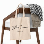 The Groom Personalised Chic Minimalist Wedding Tote Bag<br><div class="desc">This chic,  simple groom tote bag features your name underneath elegant black typography reading The Groom. Customise these elegant,  modern bridal party gifts for your wedding or bachelor party.</div>