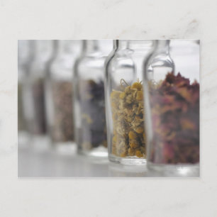 The herbs which a glass bottle contains postcard