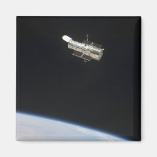 The Hubble Space Telescope in orbit above Earth 2 Magnet