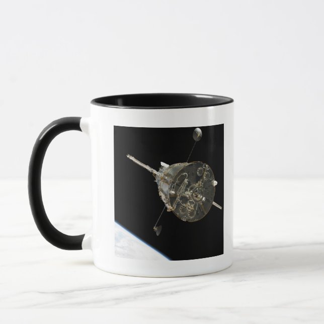 The Hubble Space Telescope in orbit above Earth Mug (Left)