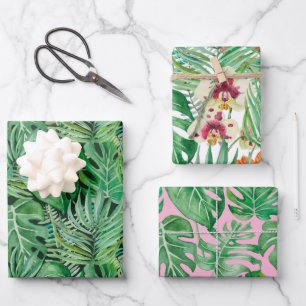 The huge leaves of palm trees and monstera wrapping paper sheet