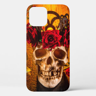 The human skull on the black table lies in the ros iPhone 12 case