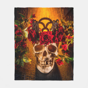 The human skull on the black table lies in the ros fleece blanket