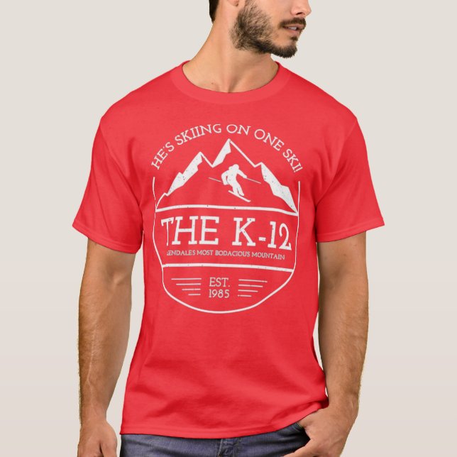 The K-12 He's Skiing on One Ski T-Shirt (Front)