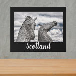 The Kelpies at Falkirk Faux Canvas Print<br><div class="desc">Wall art features scenic photograph of the Kelpies Sculpture at The Helix,  Falkirk,  Scotland.  Black background with white text overlay.</div>