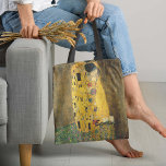 The Kiss Klimt Tote Bag<br><div class="desc">The Kiss Klimt Tote Bag - This exciting bag features Austrian painter Gustav Klimt's artwork The Kiss. The 1907 artwork depicts a couple locked in intimacy, while the rest of the painting dissolves into a shimmering, extravagant flat pattern. Style up and keep your essentials handy with this eye catching and...</div>