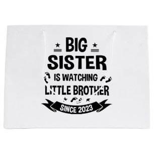 The little sister takes care of the big brother in large gift bag