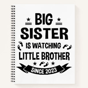 The little sister takes care of the big brother in notebook